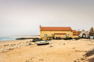 Europe, Portugal, Centro Region, coastal town, Peniche de Cima, Praia da Gamboa, boathouse with visitors Europe, Portugal, Centro Region, coastal town, Peniche de Cima, Praia da Gamboa, boathouse with visitors